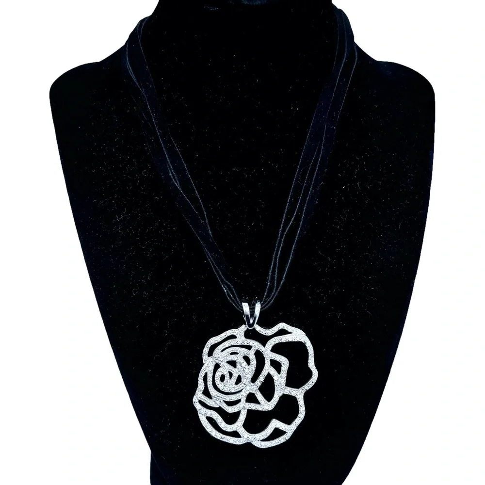 STERLING SILVER OPEN FLOWER PENDANT W MICRO PAVE STONES ON BLACK SUEDE NECKLACE